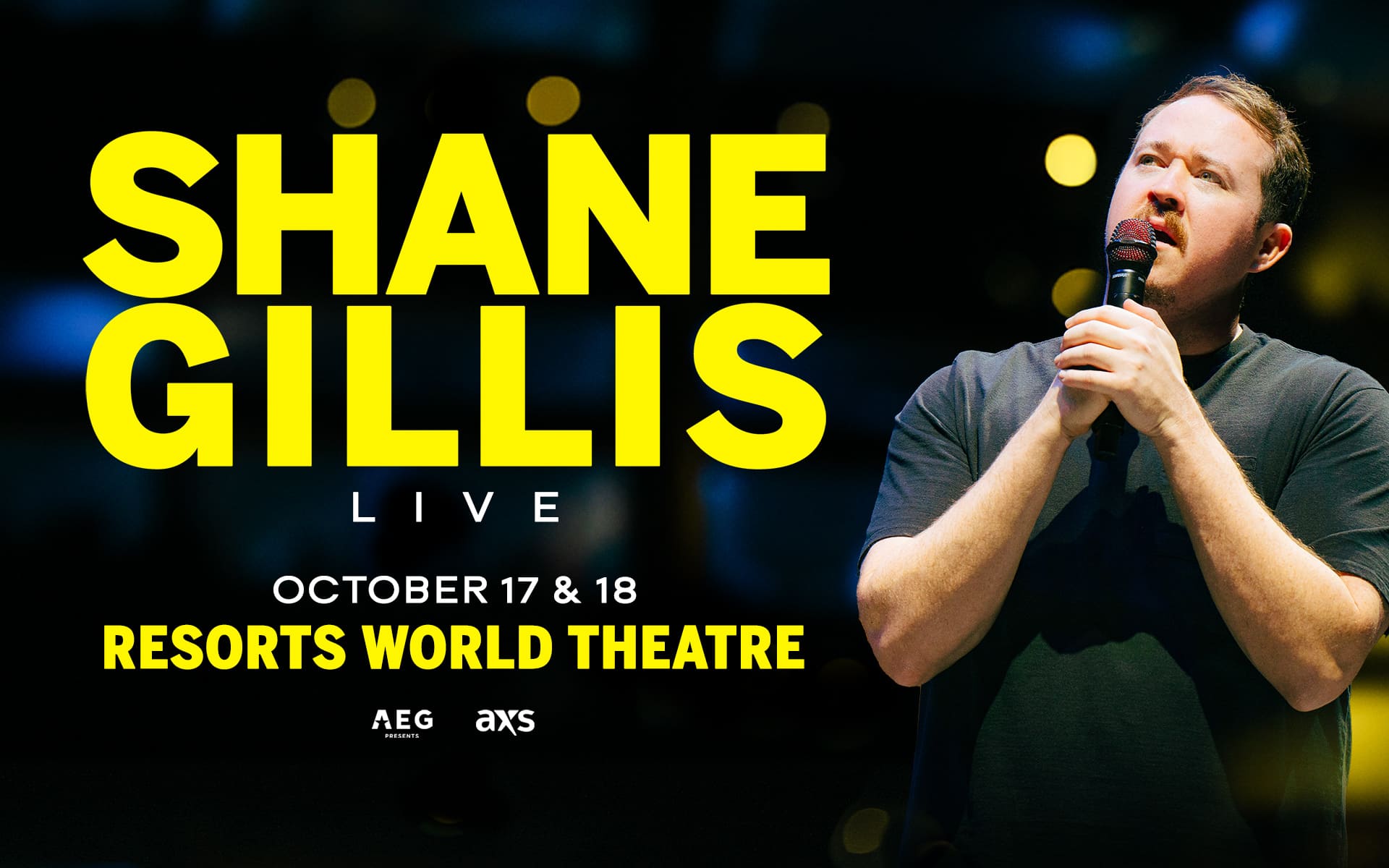 Comedian Shane Gillis performing live, holding a microphone on stage with bold yellow text announcing his October 17 and 18 shows at Resorts World Theatre.